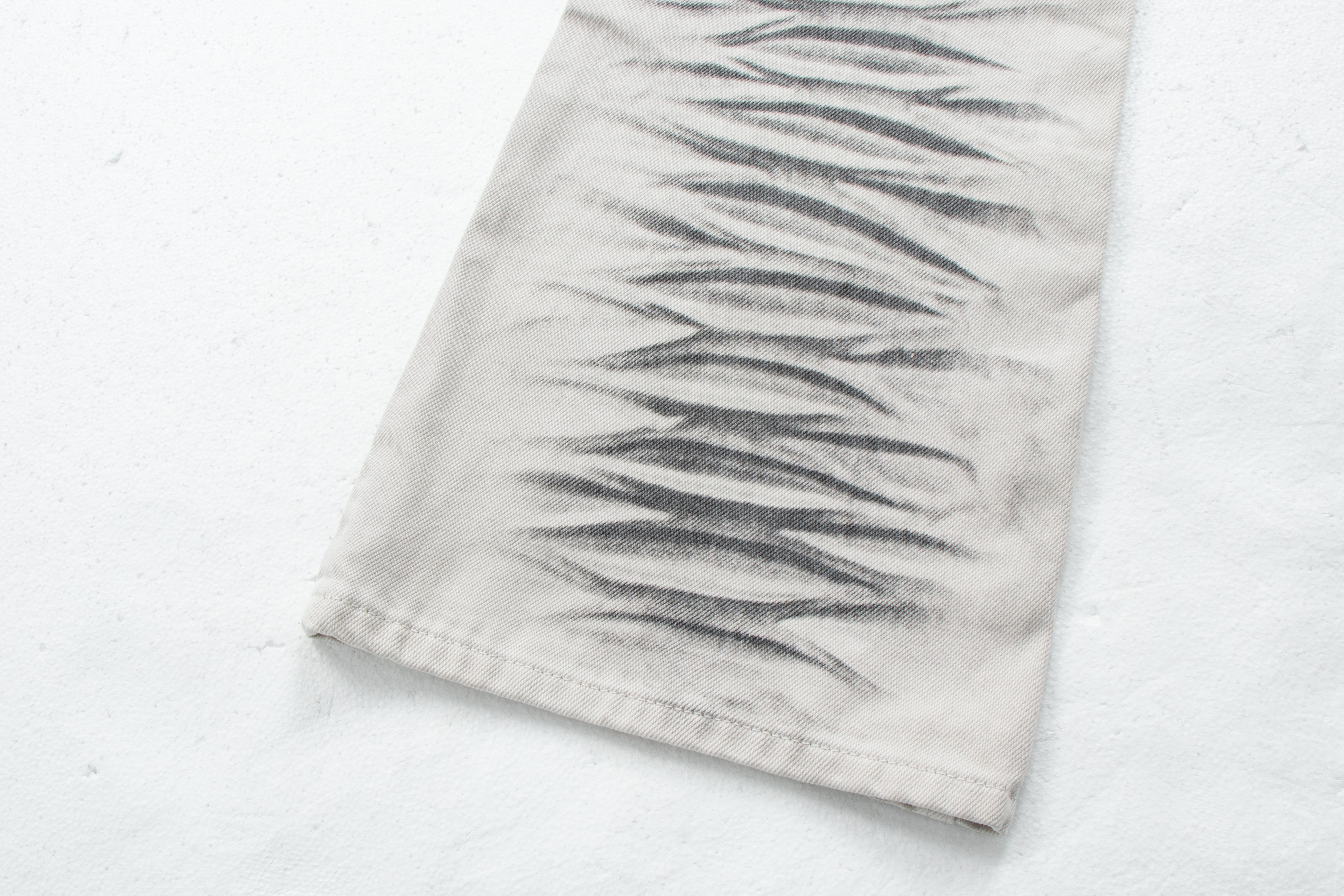 Dirty-Wash Distressed Micro-Flare Denim Jeans