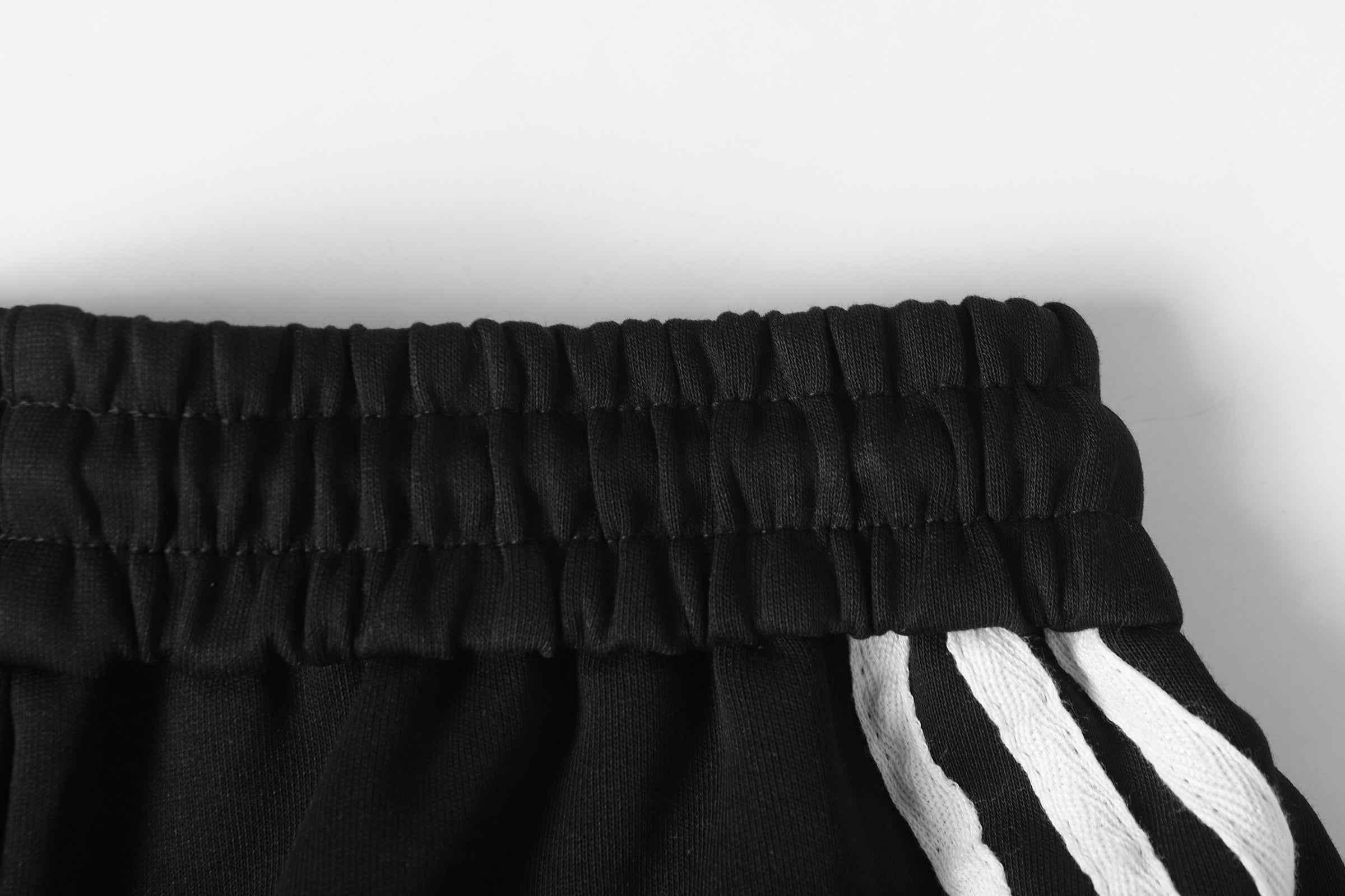 DONOTLOGO Urban Streetwear Collection | Unisex Relaxed Fit Trousers | Bold Diagonal Stripe Motif & Curved Silhouette with Soft Cotton Blend Fabric