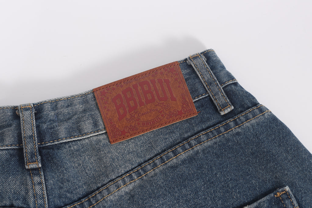 DONOTLOGO Retro Grunge Aesthetic | Unisex Baggy Star-Embellished Denim Trousers | Distressed Wash with Raw Edge Patches & Leather Brand Tag